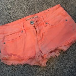 low-waisted Bullhead Black boho chic neon orange jean shorts